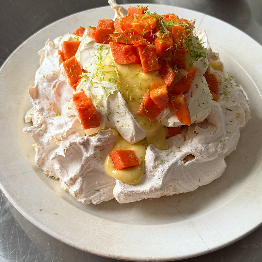 Coconut pavlova with lime curd, papaya &amp; whipped Cream 